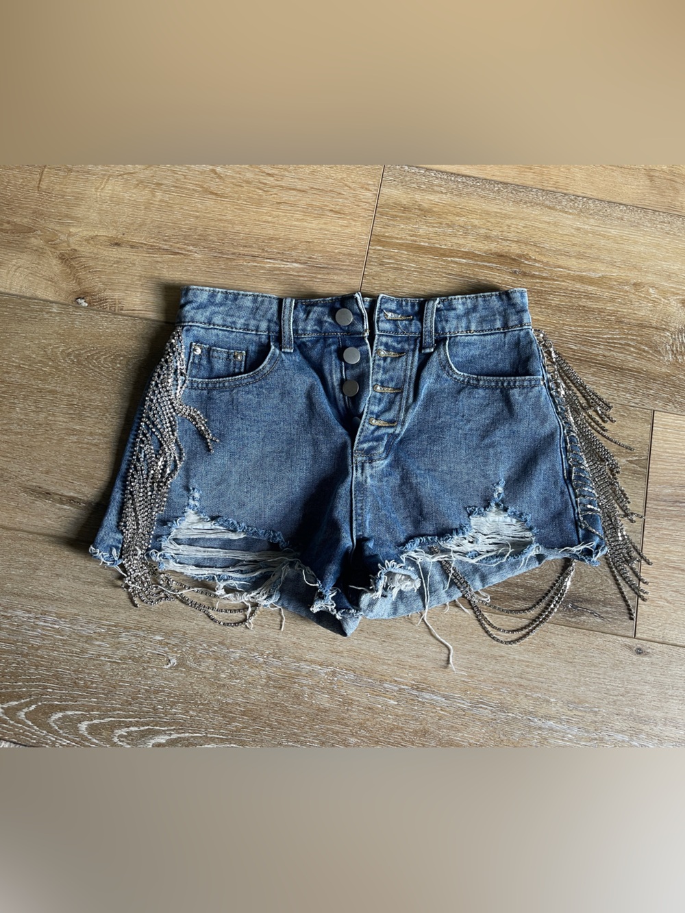 High-Rise Blue Distressed Denim Shorts with Chain Fringe